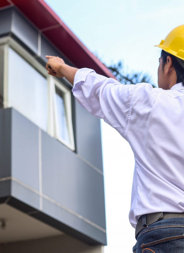 rear-view-of-construction-engineer-check-plan-work-2023-11-27-05-36-34-utc